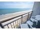 Relaxing balcony view of the ocean and beach with chairs at 1501 S Ocean Blvd. # 1540, Myrtle Beach, SC 29577