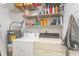 Laundry room with washer, dryer, and shelving at 8725 Chandler Dr. # F, Surfside Beach, SC 29575