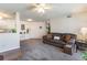 Comfortable living room with sofa and kitchen peek-a-boo at 8725 Chandler Dr. # F, Surfside Beach, SC 29575