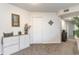 Bright hallway with a white cabinet and carpet flooring at 8725 Chandler Dr. # F, Surfside Beach, SC 29575