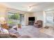 Spacious living room featuring a comfy seating area and access to a balcony at 8725 Chandler Dr. # F, Surfside Beach, SC 29575