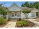 Community building with entrance, mailboxes, and landscaping at 8725 Chandler Dr. # F, Surfside Beach, SC 29575
