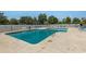 Community pool with lounge chairs and surrounding fence at 8725 Chandler Dr. # F, Surfside Beach, SC 29575
