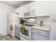 Well-equipped kitchen with white cabinets and a gas cooktop at 8725 Chandler Dr. # F, Surfside Beach, SC 29575