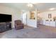 Open living room with a view of the kitchen and access to the entryway at 8725 Chandler Dr. # F, Surfside Beach, SC 29575