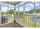 Screened porch overlooking a pond and parking lot at 8725 Chandler Dr. # F, Surfside Beach, SC 29575