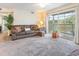 Bright living room with sliding glass door access to balcony at 8725 Chandler Dr. # F, Surfside Beach, SC 29575