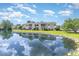Building near pond with reflection of clouds in the water at 8725 Chandler Dr. # F, Surfside Beach, SC 29575