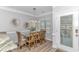 Dining area with six-chair table and access to a deck at 6001- Mh12B S Kings Hwy., Myrtle Beach, SC 29575
