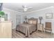 Bedroom with a queen bed, light wood floors and ceiling fan at 6001- Mh12B S Kings Hwy., Myrtle Beach, SC 29575