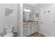 Elegant bathroom with granite countertop, white cabinets, and a toilet at 6001- Mh12B S Kings Hwy., Myrtle Beach, SC 29575