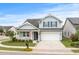 Two-story house with gray siding, white trim, and a two-car garage at 1433 Beaumont Way, Myrtle Beach, SC 29577