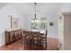 Bright dining room with hardwood floors and an adjacent kitchen at 1433 Beaumont Way, Myrtle Beach, SC 29577
