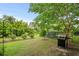Landscaped backyard with grill and privacy fence at 1433 Beaumont Way, Myrtle Beach, SC 29577