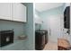 Functional laundry room with washer, dryer and storage cabinets at 1433 Beaumont Way, Myrtle Beach, SC 29577