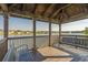 Wooden gazebo overlooking a pond with benches and views of the neighborhood at 1433 Beaumont Way, Myrtle Beach, SC 29577