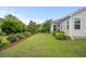Side yard with garden and view of the home's exterior at 1433 Beaumont Way, Myrtle Beach, SC 29577