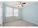 Bright bedroom with carpeted floor, ceiling fan, and window with sheer curtains at 1433 Beaumont Way, Myrtle Beach, SC 29577