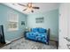 Bedroom with twin daybed, ceiling fan and colorful bedding at 1433 Beaumont Way, Myrtle Beach, SC 29577