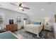 Charming bedroom with a queen-size bed, dresser and ceiling fan at 1433 Beaumont Way, Myrtle Beach, SC 29577