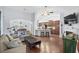 Open living room features hardwood floors, a fireplace, and a view into the kitchen at 1433 Beaumont Way, Myrtle Beach, SC 29577