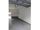 Bright and airy garage with shelving and door to outside at 4889 Magnolia Point Ln. # Garage 30, Myrtle Beach, SC 29577