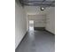 Clean and well-lit garage with shelving for storage at 4889 Magnolia Point Ln. # Garage 30, Myrtle Beach, SC 29577