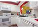 White kitchen with stainless steel appliances and ample counter space at 4396 Baldwin Ave. # 109, Little River, SC 29566