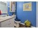 Small bathroom with a vanity, toilet, and decorative artwork at 4396 Baldwin Ave. # 109, Little River, SC 29566