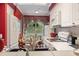 White kitchen with stainless steel appliances and a breakfast bar at 4396 Baldwin Ave. # 109, Little River, SC 29566