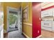 Bright entryway with open door revealing a patio and kitchen at 4396 Baldwin Ave. # 109, Little River, SC 29566