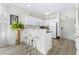 Well-equipped kitchen with white cabinetry, granite counters, and breakfast bar at 242 Sun Colony Blvd. # 101, Longs, SC 29568