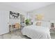 Relaxing bedroom with a cozy bed, attached bathroom, and a home office space at 242 Sun Colony Blvd. # 101, Longs, SC 29568