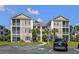 Two story beige building with screened porches at 242 Sun Colony Blvd. # 101, Longs, SC 29568