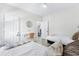Cozy bedroom with twin beds, a small workspace, and access to another room at 242 Sun Colony Blvd. # 101, Longs, SC 29568