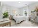 Bright bedroom with plush bedding, a work area, and ample natural light at 242 Sun Colony Blvd. # 101, Longs, SC 29568