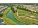 Community overview showcasing houses, ponds, and a golf course, highlighting a peaceful setting at 242 Sun Colony Blvd. # 101, Longs, SC 29568