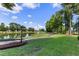 Waterfront view with walking path and lush greenery, ideal for outdoor recreation at 242 Sun Colony Blvd. # 101, Longs, SC 29568