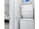 Convenient laundry room with a stacked washer and dryer at 242 Sun Colony Blvd. # 101, Longs, SC 29568
