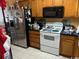 Kitchen with stainless steel appliances and wood cabinets at 1025 Carolina Rd. # R-1, Conway, SC 29526
