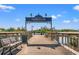 Harborwalk entrance with benches and views of the water at 132 Oak Bay Dr., Georgetown, SC 29440