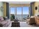 Living room with ocean view and comfy seating at 2801 S Ocean Blvd. # 1838, North Myrtle Beach, SC 29582