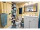 Clean bathroom with white vanity, and a toilet, and shelving at 2801 S Ocean Blvd. # 1838, North Myrtle Beach, SC 29582