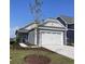 Charming house with a two-car garage and well-manicured lawn at 614 Castle Ct., Myrtle Beach, SC 29579