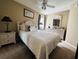 Queen bed, nightstands, and ceiling fan in a condo bedroom at 1401 S Ocean Blvd. # 1001, North Myrtle Beach, SC 29582