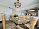 Spacious dining area with a glass-top table and wicker chairs at 1401 S Ocean Blvd. # 1001, North Myrtle Beach, SC 29582