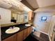 Double vanity, granite countertop, and a walk-in shower in a condo bathroom at 1401 S Ocean Blvd. # 1001, North Myrtle Beach, SC 29582