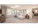 Cozy bonus room with L-shaped sofa and view into a bedroom at 7089 Watercress St, Myrtle Beach, SC 29579