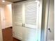 White louvered double door closet in a hallway at 150 Wedgefield Village Rd. # 24, Georgetown, SC 29440