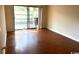 Spacious living area featuring wood-look floors and access to a private patio at 150 Wedgefield Village Rd. # 24, Georgetown, SC 29440